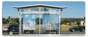 A digital reproduction of artwork by Grace Wang, printed on glass at a BRT station.