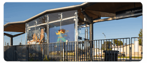 A digital reproduction of artwork by Lisette Febrero and Samantha Haslam at a BRT station