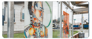 A digital reproduction of artwork by Leann Gomez and Nicole Wolf at a BRT station