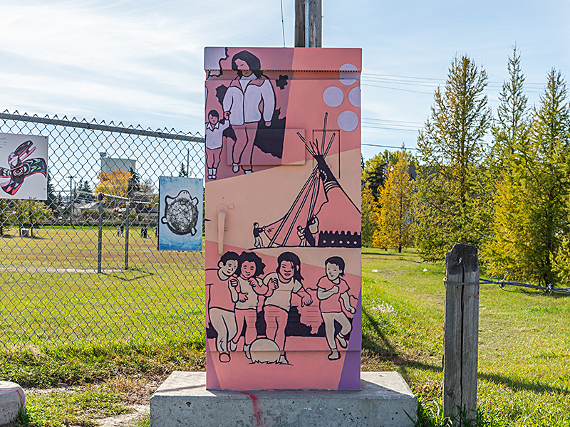 Utility box painted with scenes of people walking, children playing, and a traditional tipi, in shades of pink and peach.