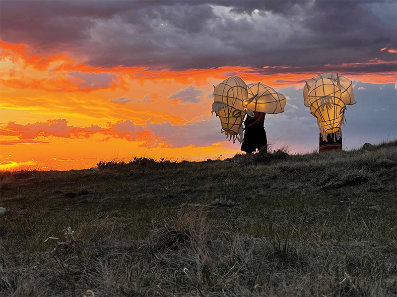 Still of a colourful sunset from: Iniskim: Return of the Buffalo, by Peter Balkwill