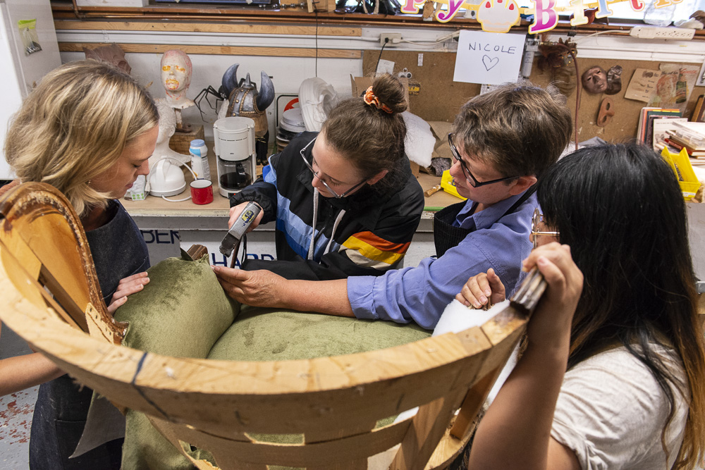 Photo of prop makers building furniture in a studio