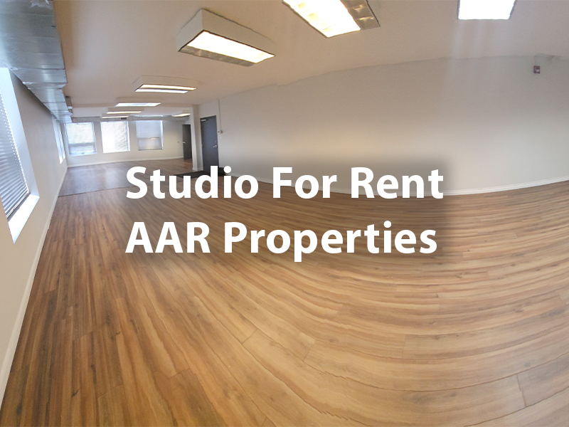 a studio with bright light and hardwood floors with copy: Studio for Rent AAR Properties