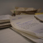 A pile of letters for Citizen of the Century nominations, this one at the top is Tom Baines.