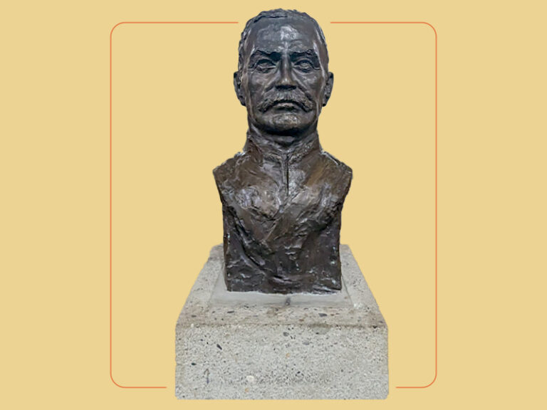 A bronze bust sculpture on a concrete base of Colonel McLeod
