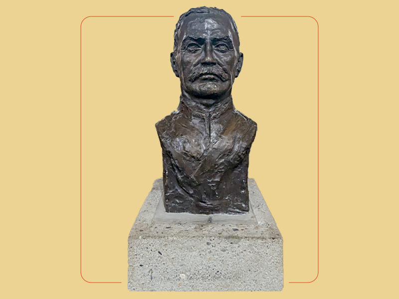 A bronze bust sculpture on a concrete base of Colonel McLeod