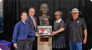 People in front of the bronze sculpture upon opening the time capsule, including 3rd from left, Mayor Jyoti Gondek.
