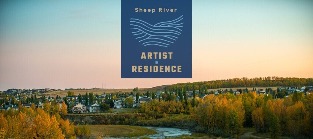 Photograph with graphic for the Arist in Residence program for Sheep River over an image of a town on a hillside with green trees and a colourful sky.