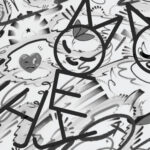 Black and white artwork featuring stylized cat-like figures forming the word “LIFE” with their bodies. The background is filled with swirling abstract patterns, cartoon hearts, and expressive faces. The bottom right corner includes the artist name “INDIOZ BRAVOZ.”