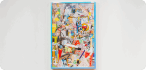 A colourful collage-style artwork made from many layered images and objects, framed and hung on a white wall.