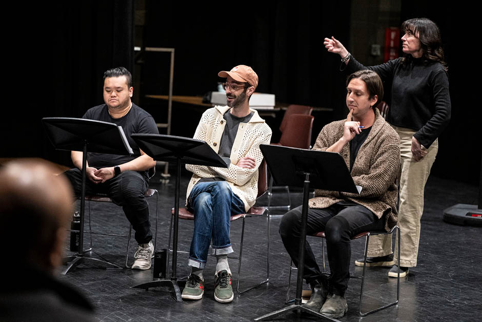 People reading scripts on stands with an instructor behind them at Banff Centre